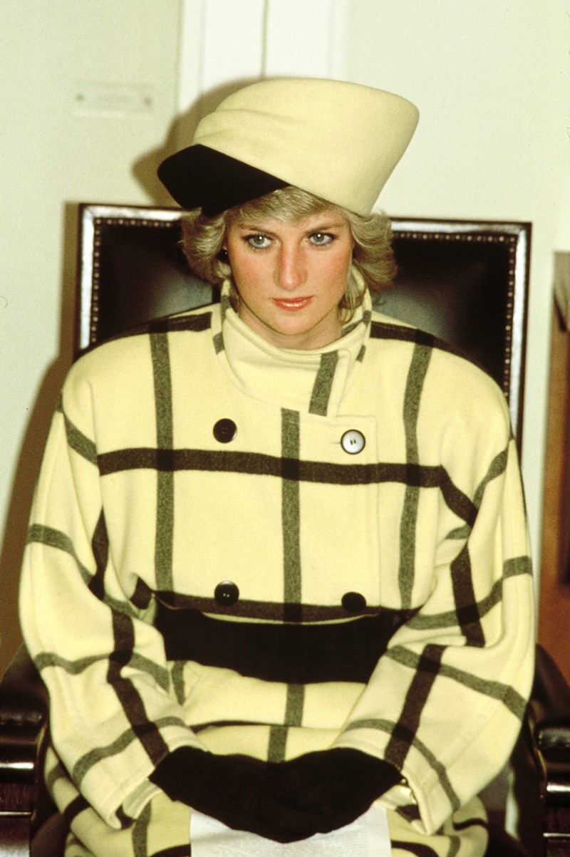 Diana, Princess of Wales, wearing a yellow and black check coat designed by Escada and a matching hat designed by Philip Somerville, attends a welcome ceremony at the Rathaus on November 1, 1987 in Berlin, Germany. 