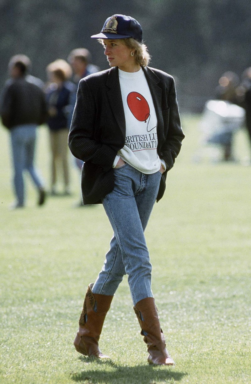 Diana, Princess Of Wales At Guards Polo Club. The Princess Is Casually Dressed In A Sweatshirt With The British Lung Foundation Logo On The Front, Jeans, Boots And A Baseball Cap.